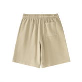 Back view of Vintage Wash Logo Shorts in light beige, featuring a comfortable elastic waistband and single back pocket.