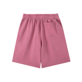 Vintage Wash Logo Shorts in soft pink color with an elastic waistband and side pocket for relaxed streetwear style.