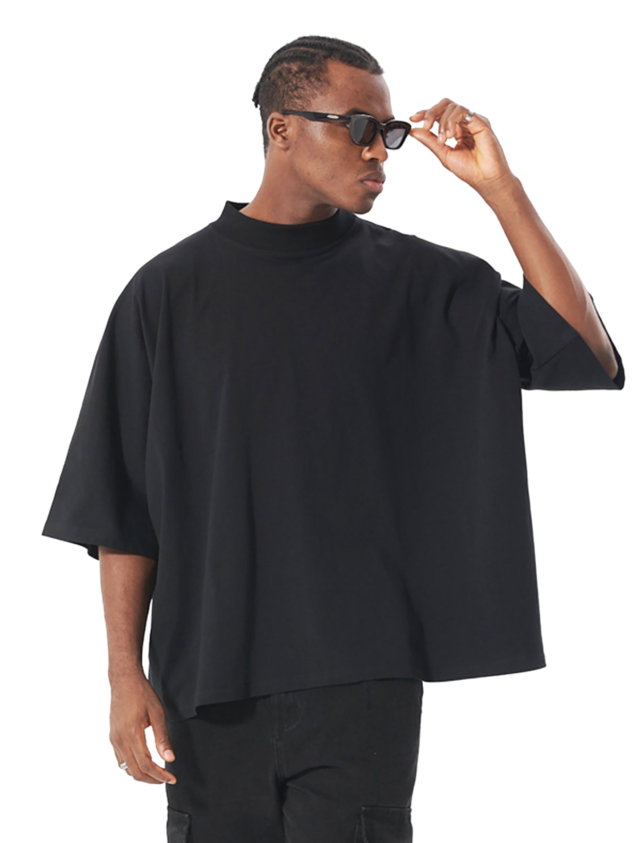 Man wearing an Oversized Boxy Graphic Tee in black, styled for a modern streetwear look with sunglasses.