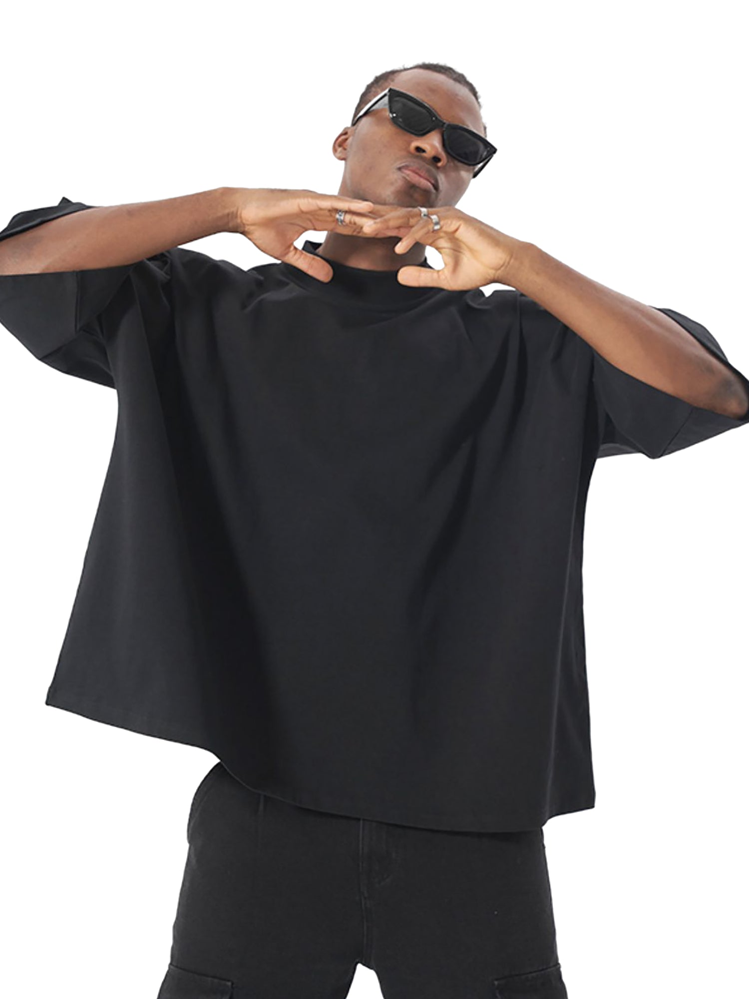 Oversized Boxy Graphic Tee worn by a model in black, showcasing modern streetwear style and relaxed fit.